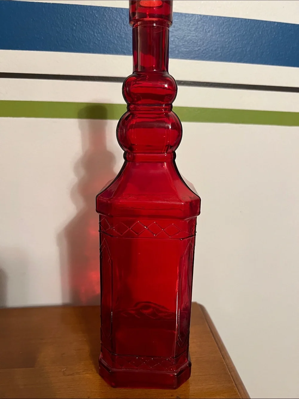 Vintage Ruby Red Embossed Glass Bottle Tall 11.75”